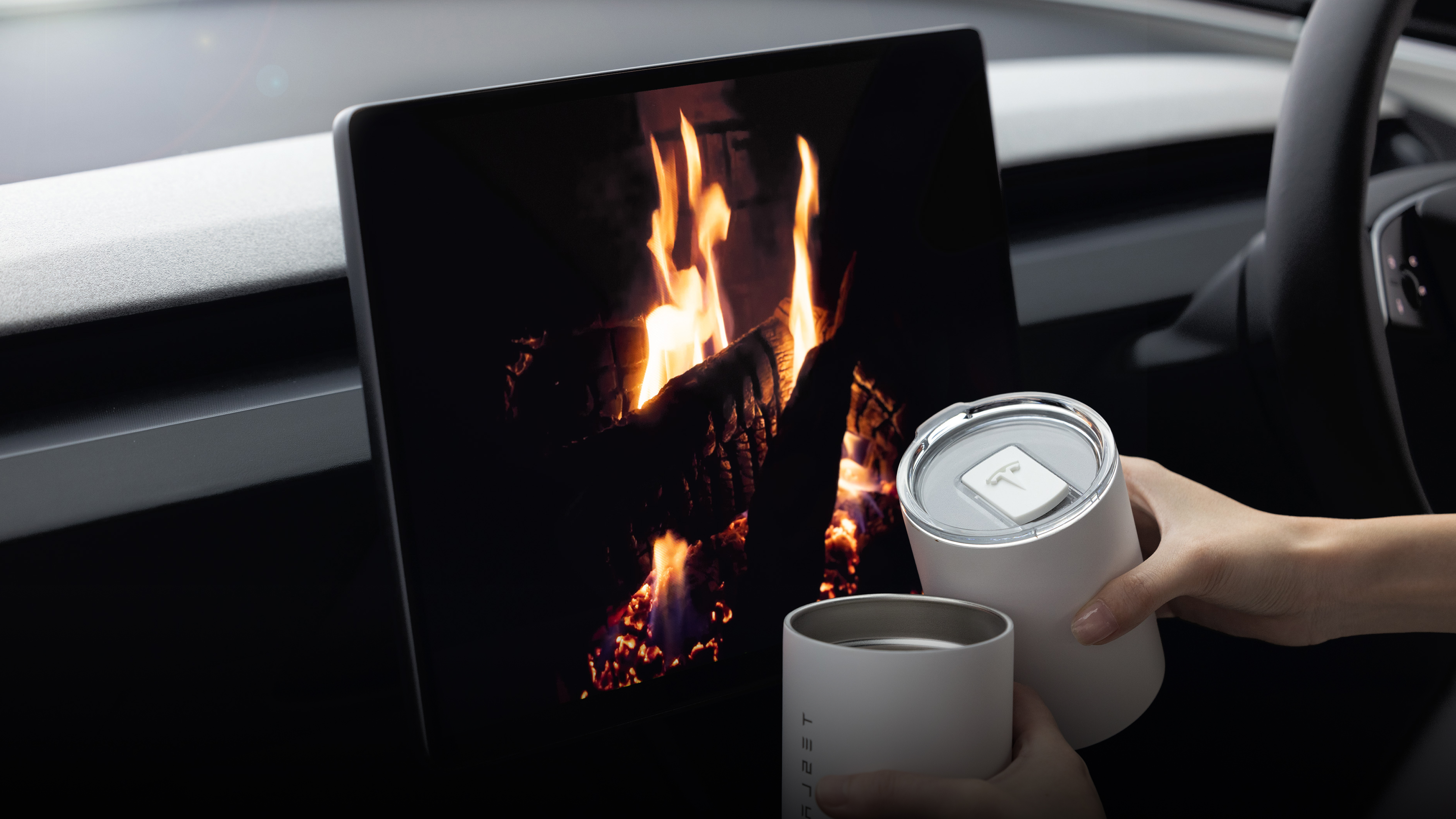 Center touchscreen displaying fireplace visuals.